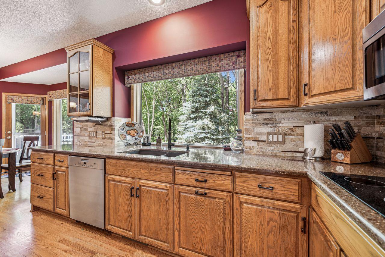Kitchen window looks out to private backyard and allows plenty of natural light