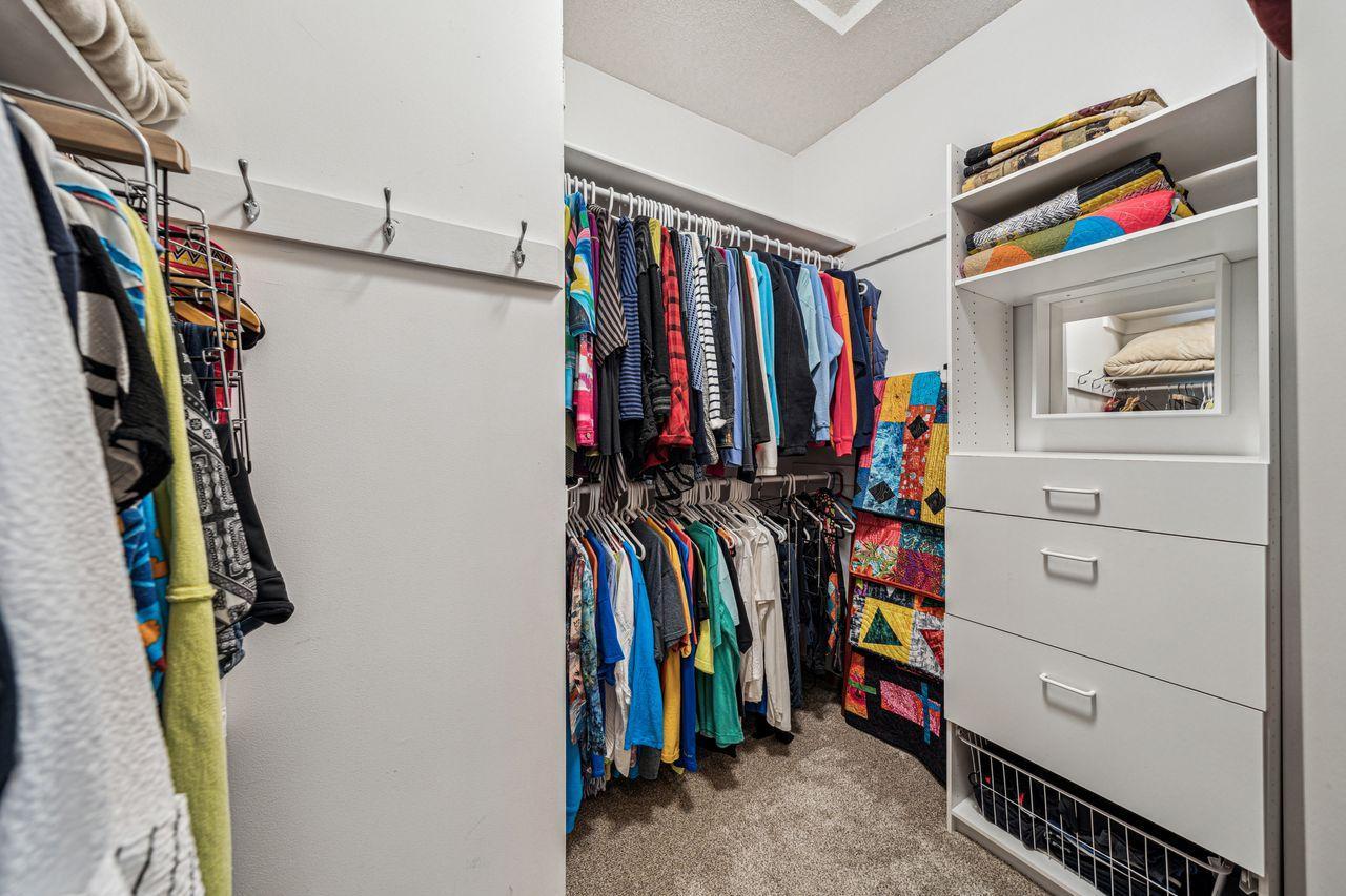 Main floor primary walk-in closet.