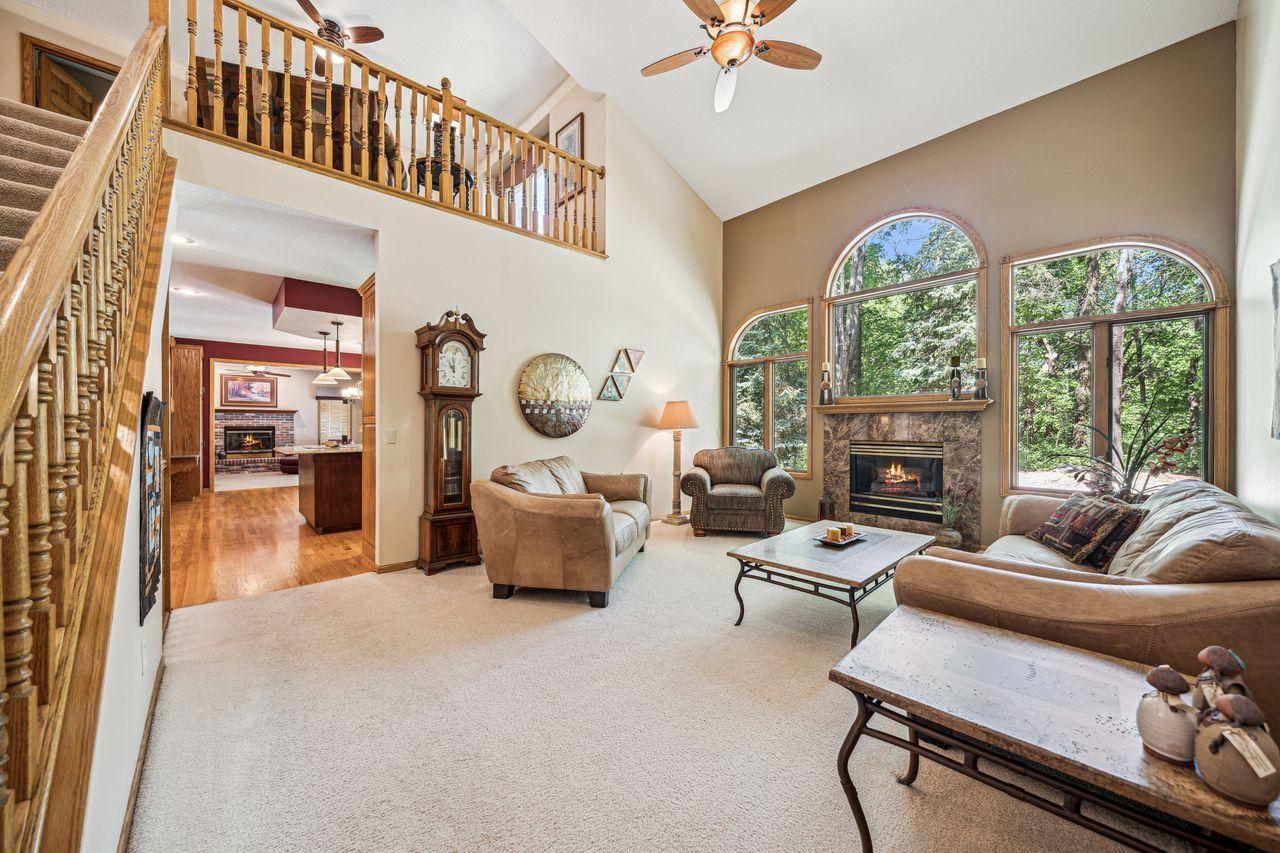 Soaring vaults in Great room with wall of windows and fireplace