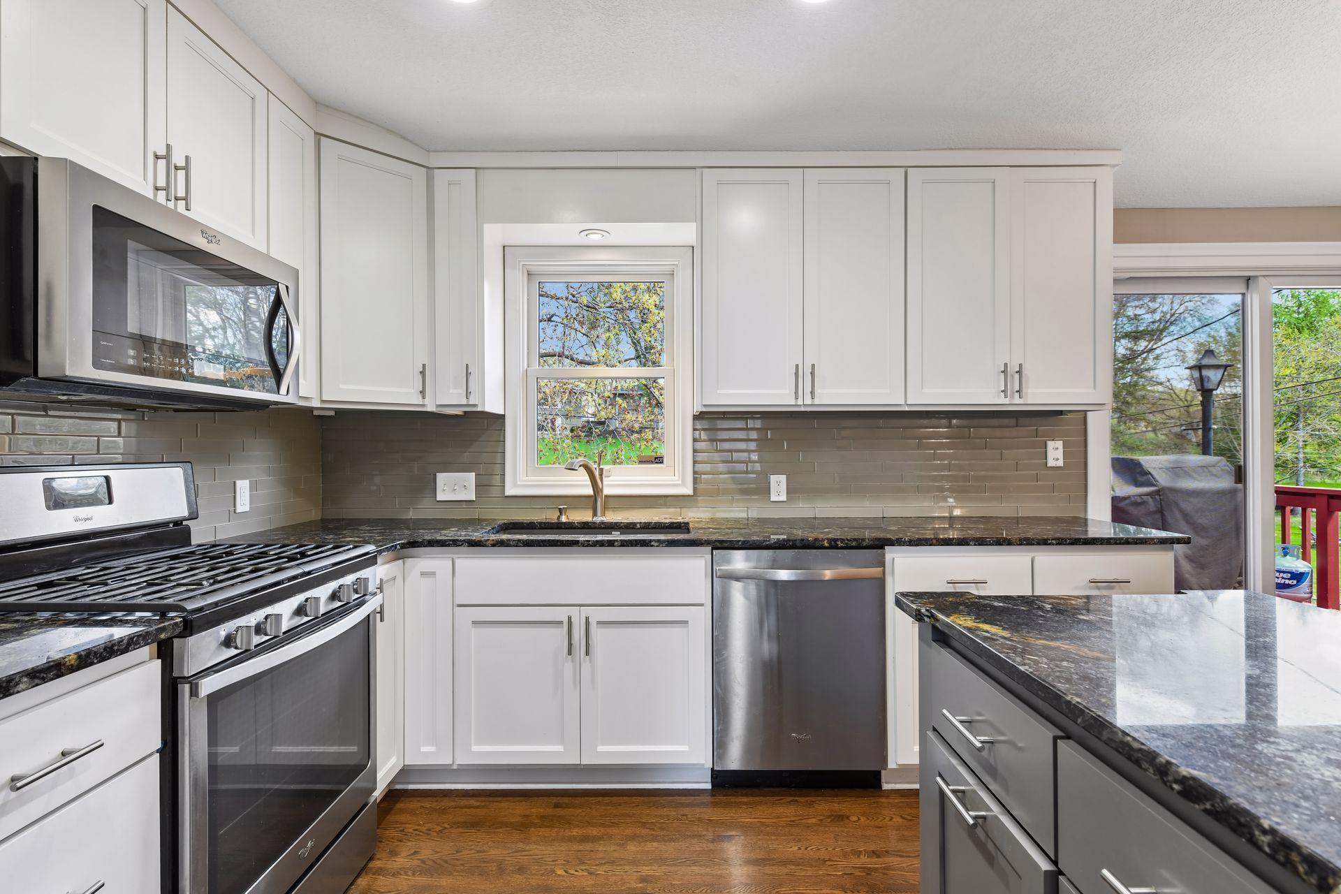 Stainless appliances in clean kitchen