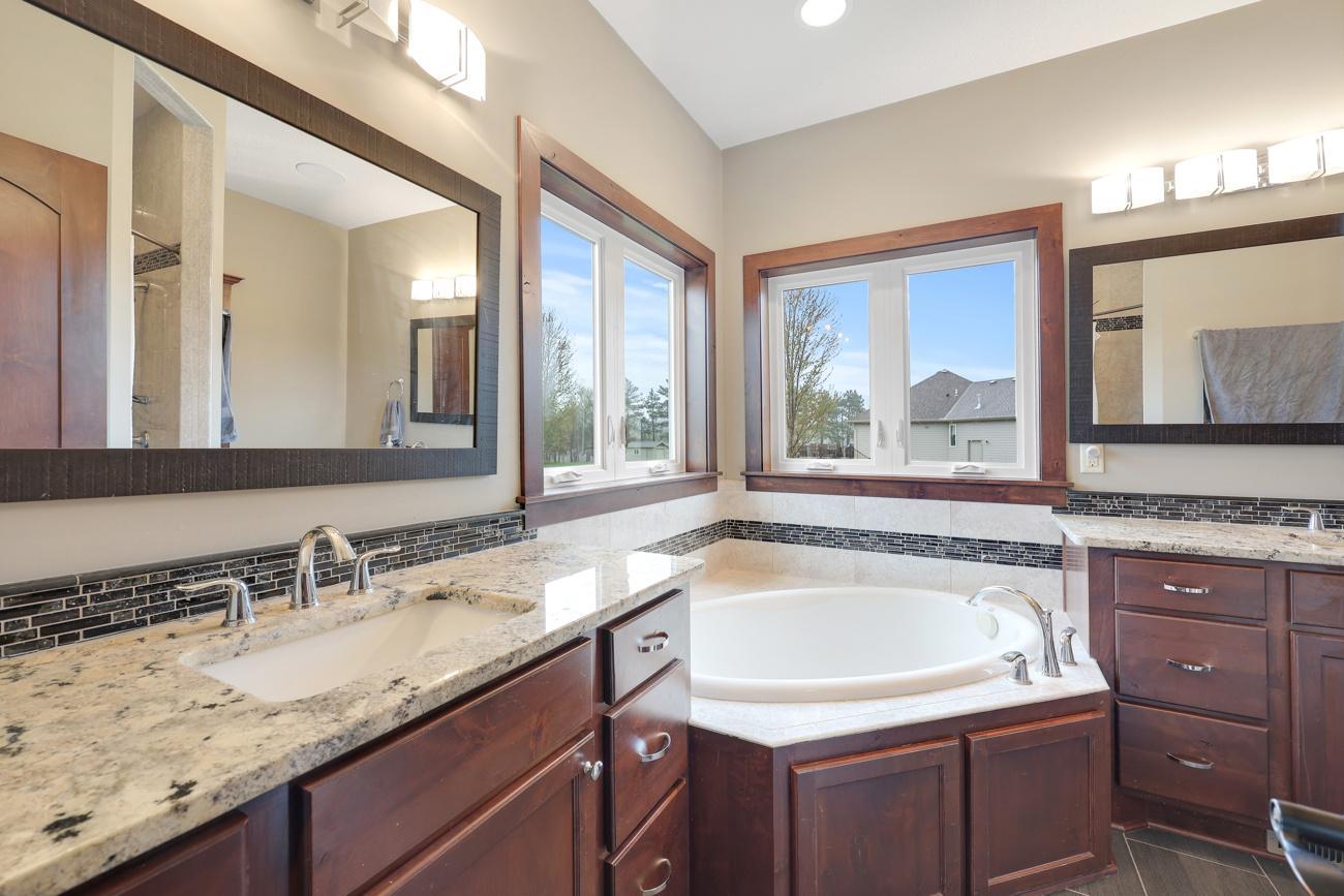 Primary Ensuite Bathroom With Heated Floors/Dual Sinks/Jetted Tub/Separate Tile Shower