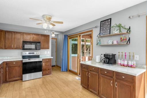 Additional cabinets for a coffee bar or meal prep. Sliding patio door goes out to the screen porch.