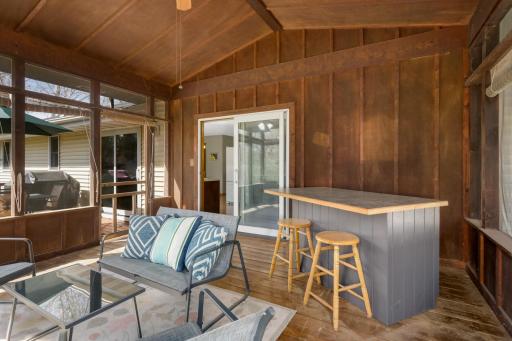 Another view of the screen porch. The bar will stay with the home.