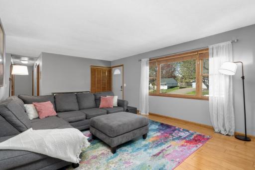 Entry from the exterior is spacious and open. Note the coat closet adjacent to the door and space for a bench, storage or decor.