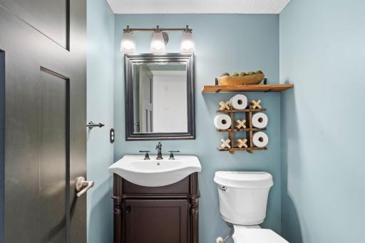 Stylish and functional main level powder room with easy access from the main living spaces.
