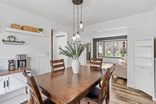 Thoughtfully connected dining and living spaces offer both functionality and a welcoming atmosphere.