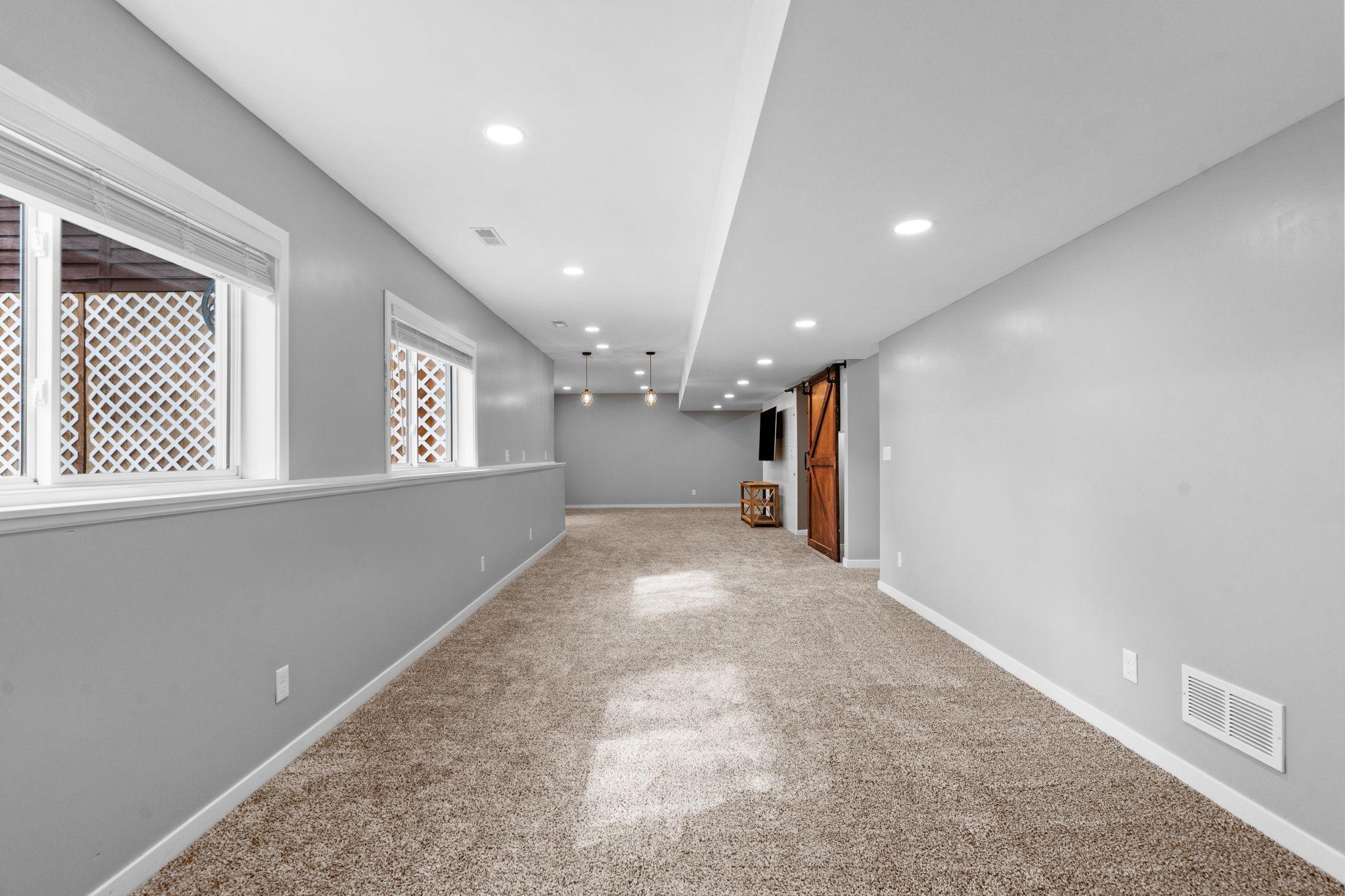 The kind of basement everyone wants…open, updated, bright, and functional