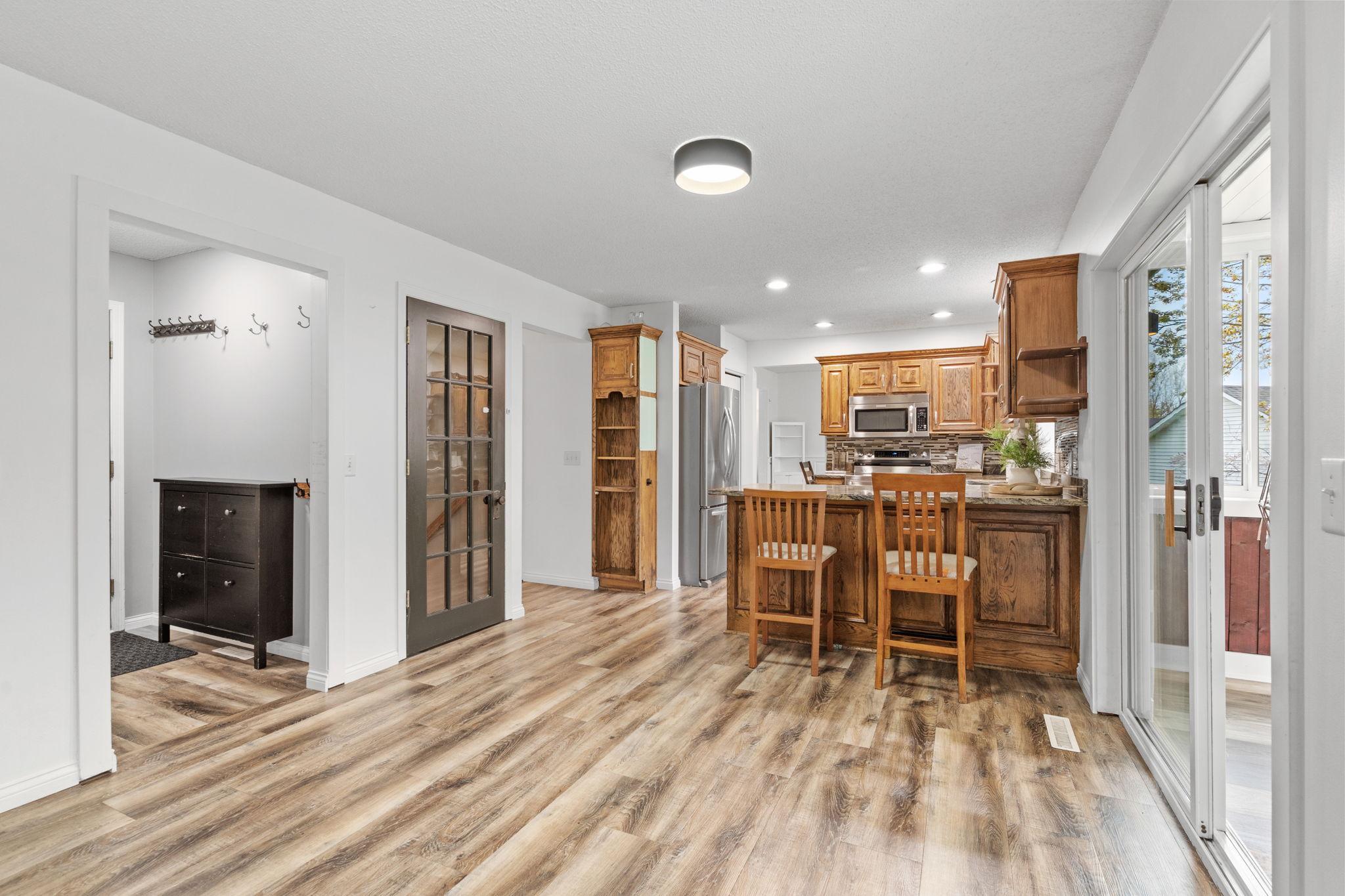 Open-concept kitchen with peninsula seating, abundant prep space, and easy flow into the dining and living areas.
