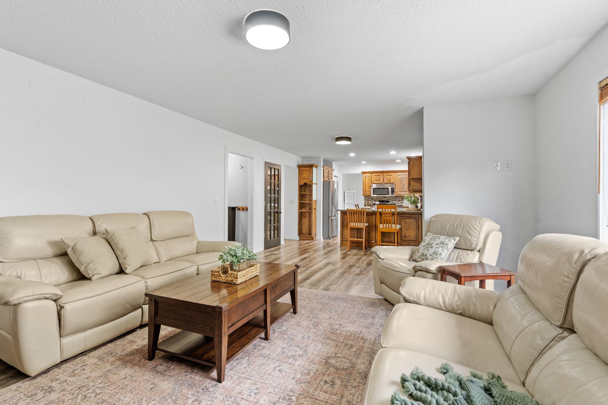 Thoughtfully updated gathering space with modern finishes, warm tones, and excellent flow throughout the main level.