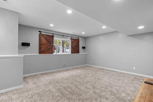 Lookout windows make this remodeled lower level feel anything but basement living