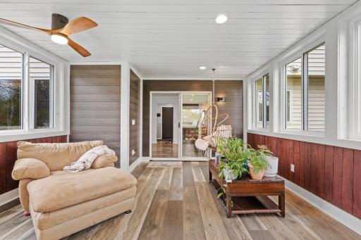 A true extension of the home featuring warm wood accents, expansive windows, and flexible year-round living space.