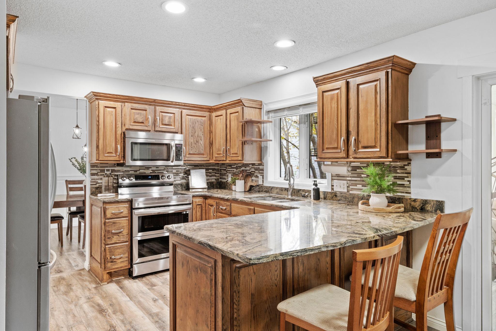 Efficient kitchen layout with generous prep space, abundant cabinetry, and everything within easy reach.