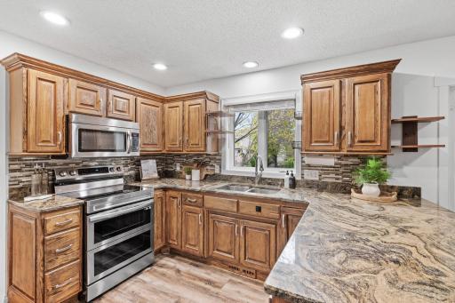 Thoughtfully designed kitchen featuring extensive cabinetry, expansive counters, and a layout ideal for everyday living and entertaining.