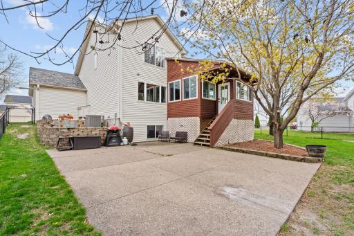 From summer BBQs on the patio to evenings under the trees, this backyard was made to enjoy Minnesota seasons