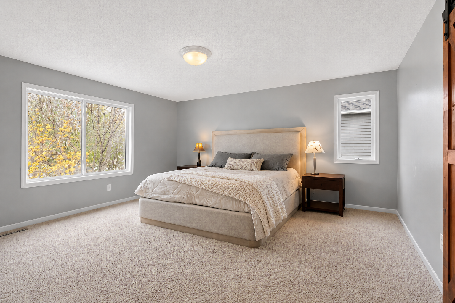 Relaxing primary bedroom retreat complete with an impressive 20x5 walk-in closet designed with custom organization features.