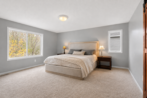 Relaxing primary bedroom retreat complete with an impressive 20x5 walk-in closet designed with custom organization features.