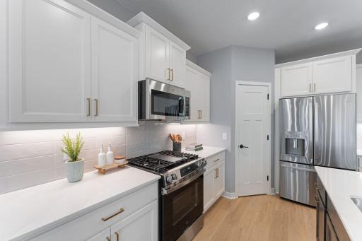 Low maintenance silestone quartz countertops in both kitchens and bathrooms!