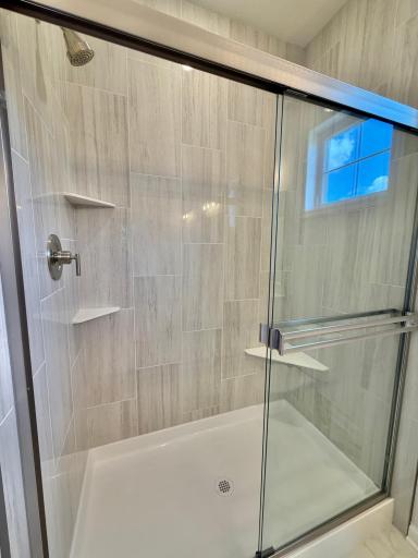 The tiled shower is the standout of the primary bath!