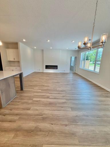 The open concept kitchen, dining and family room offer plenty of space for entertaining! LVP throughout gives the ultimate flexibility for furniture arrangement.
