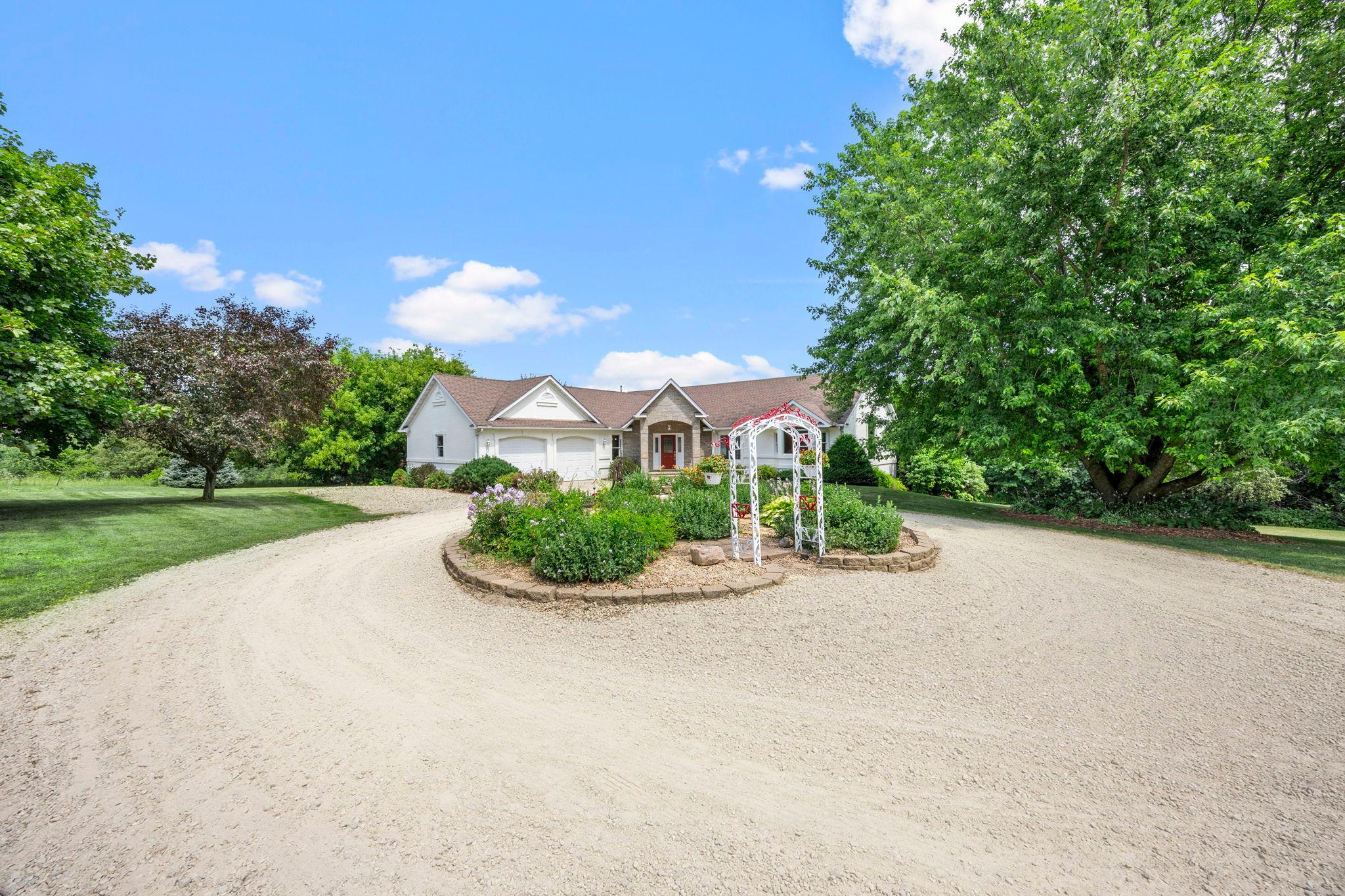 Main level living with a large lower level walkout offering two additional bedrooms, bar entertainment area & bath.
