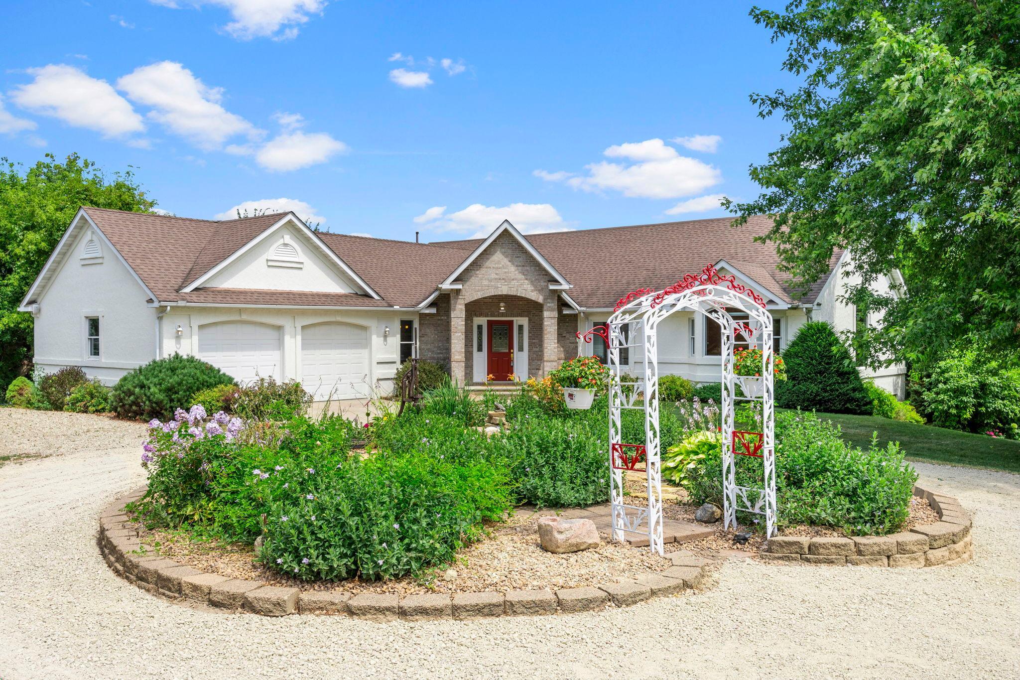 Artistically landscaped with running fountain in garden.