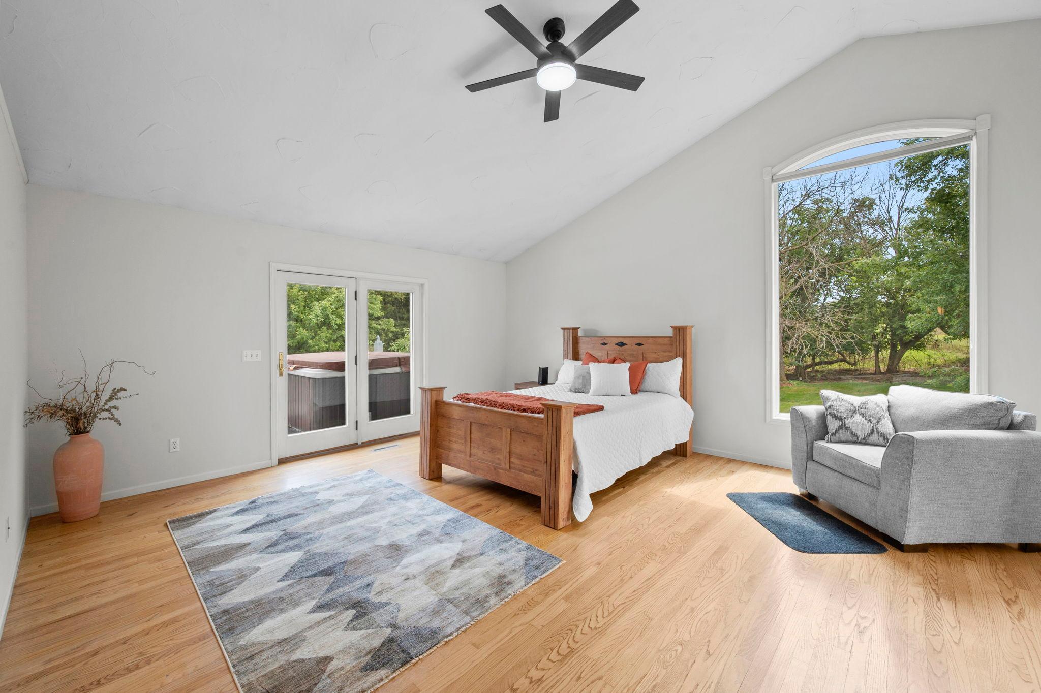Primary suite walks out to expansive deck overlooking large back yard, nature and 2 mature Apple Trees!