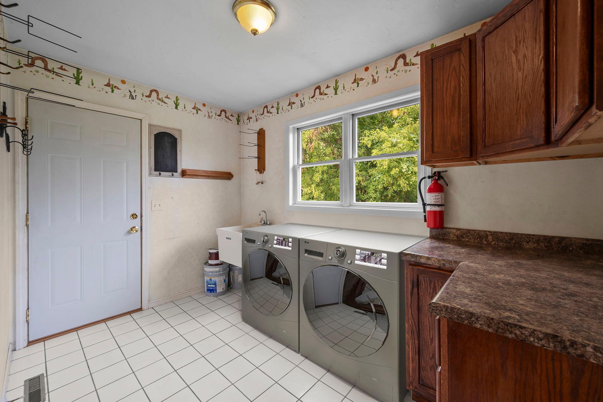 New (August 2026) Whirlpool Washer & Dryer are on the main level just inside the garage entrance.
