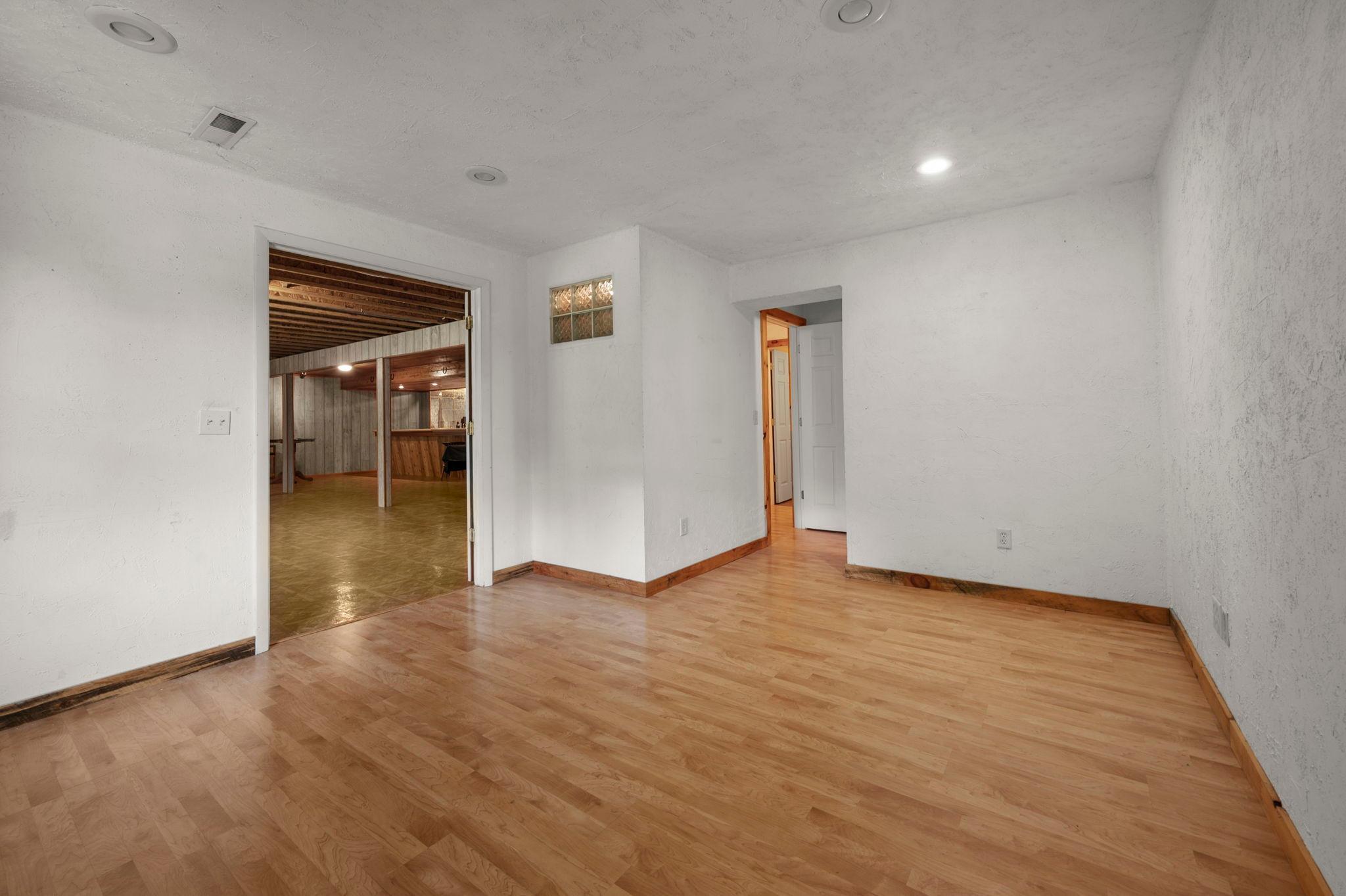 3rd bedroom in lower level opens to entertainment room.