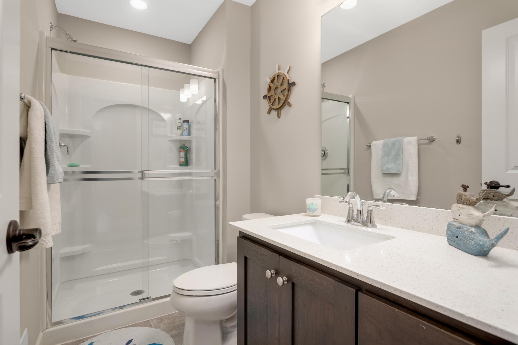 This 3/4 bathroom is adjacent to the bedroom.