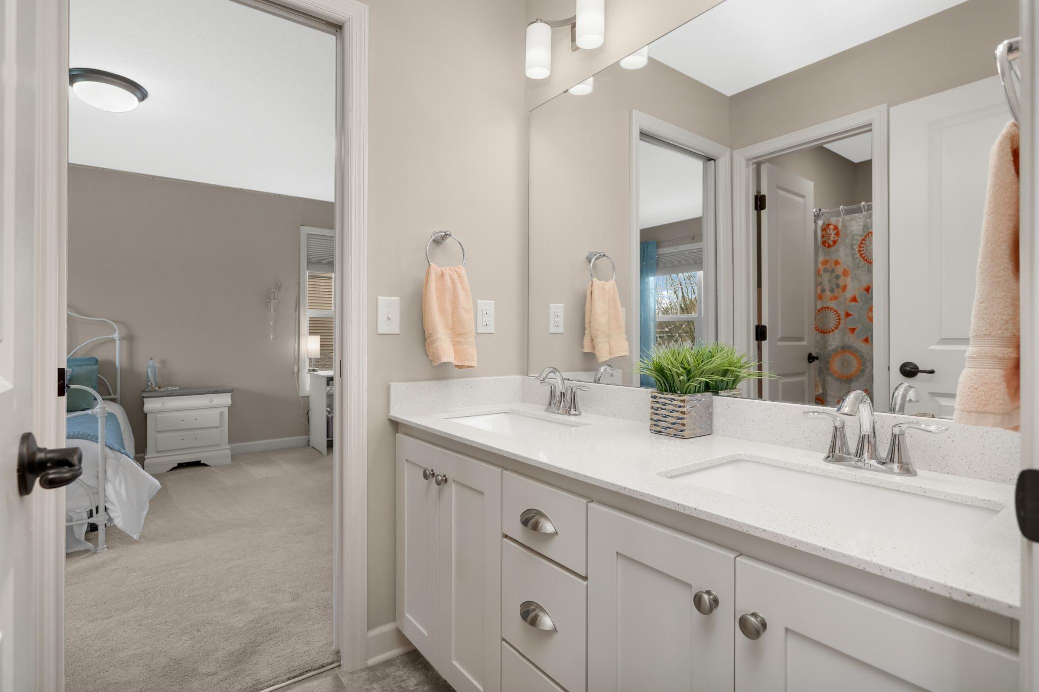 Jack and Jill bath adjoins two of the upper level bedrooms.