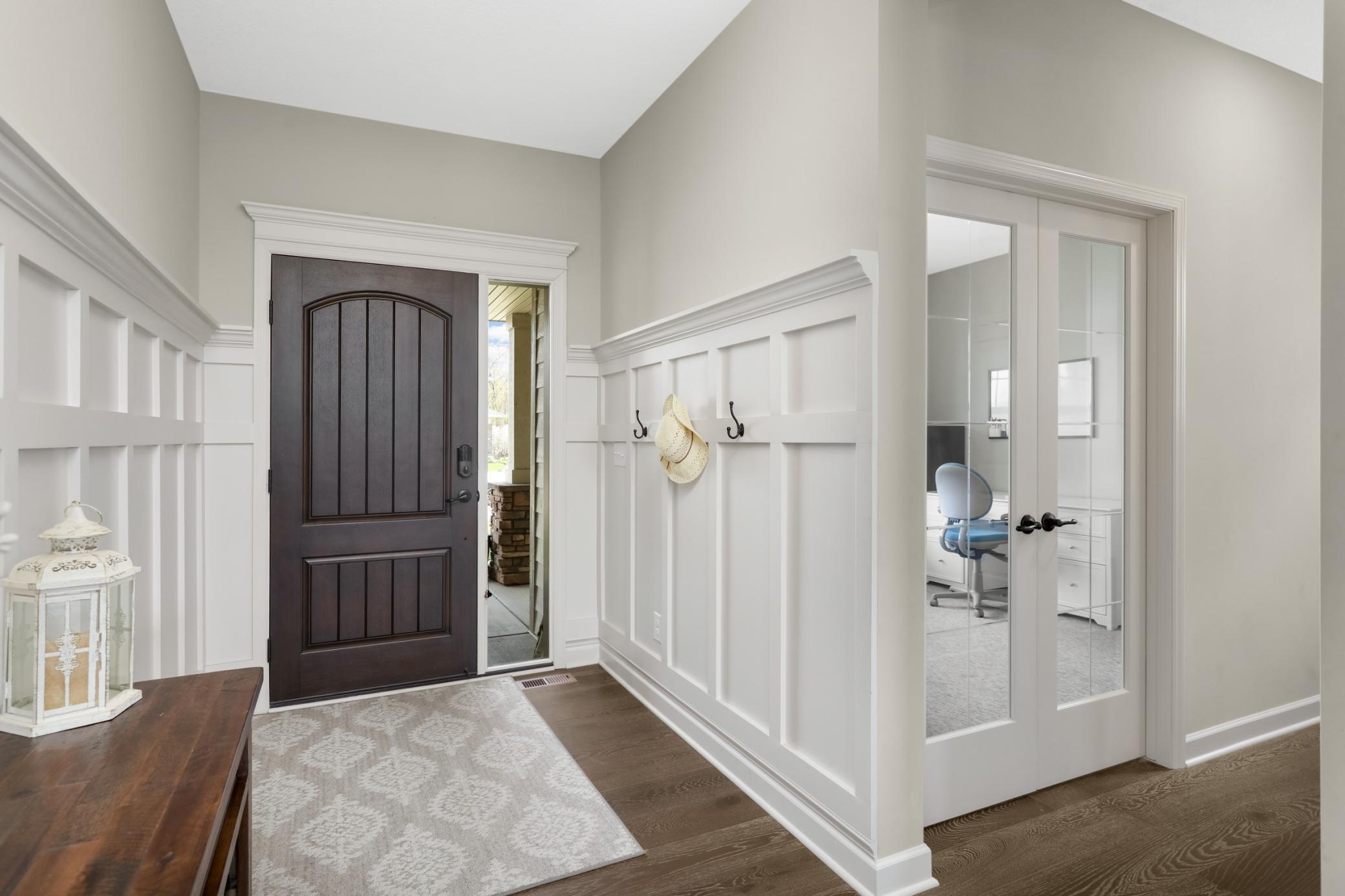 Main floor office/flex room with french doors is just off the front entrance.