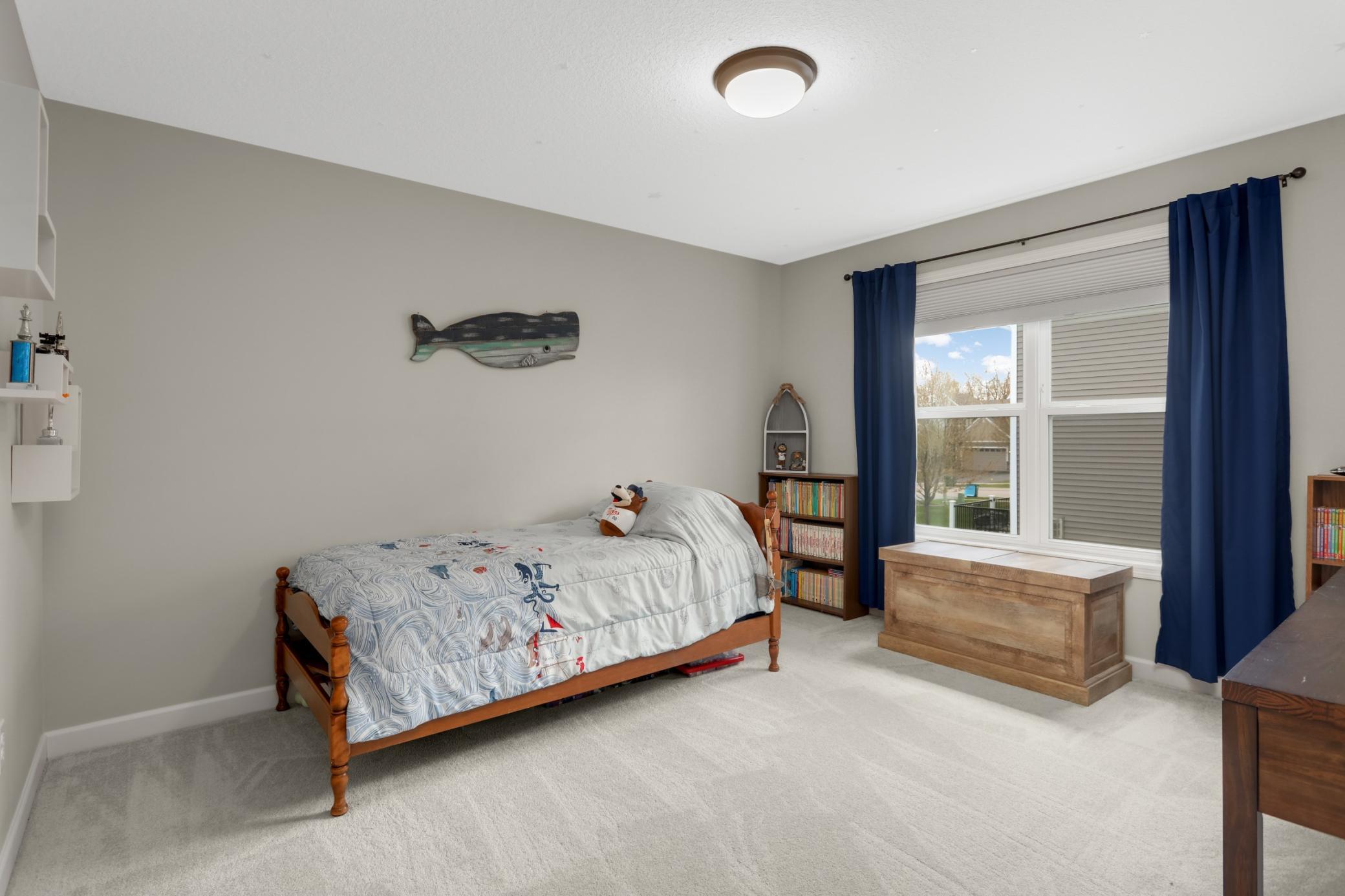 One of four generously sized bedrooms in the upper level.