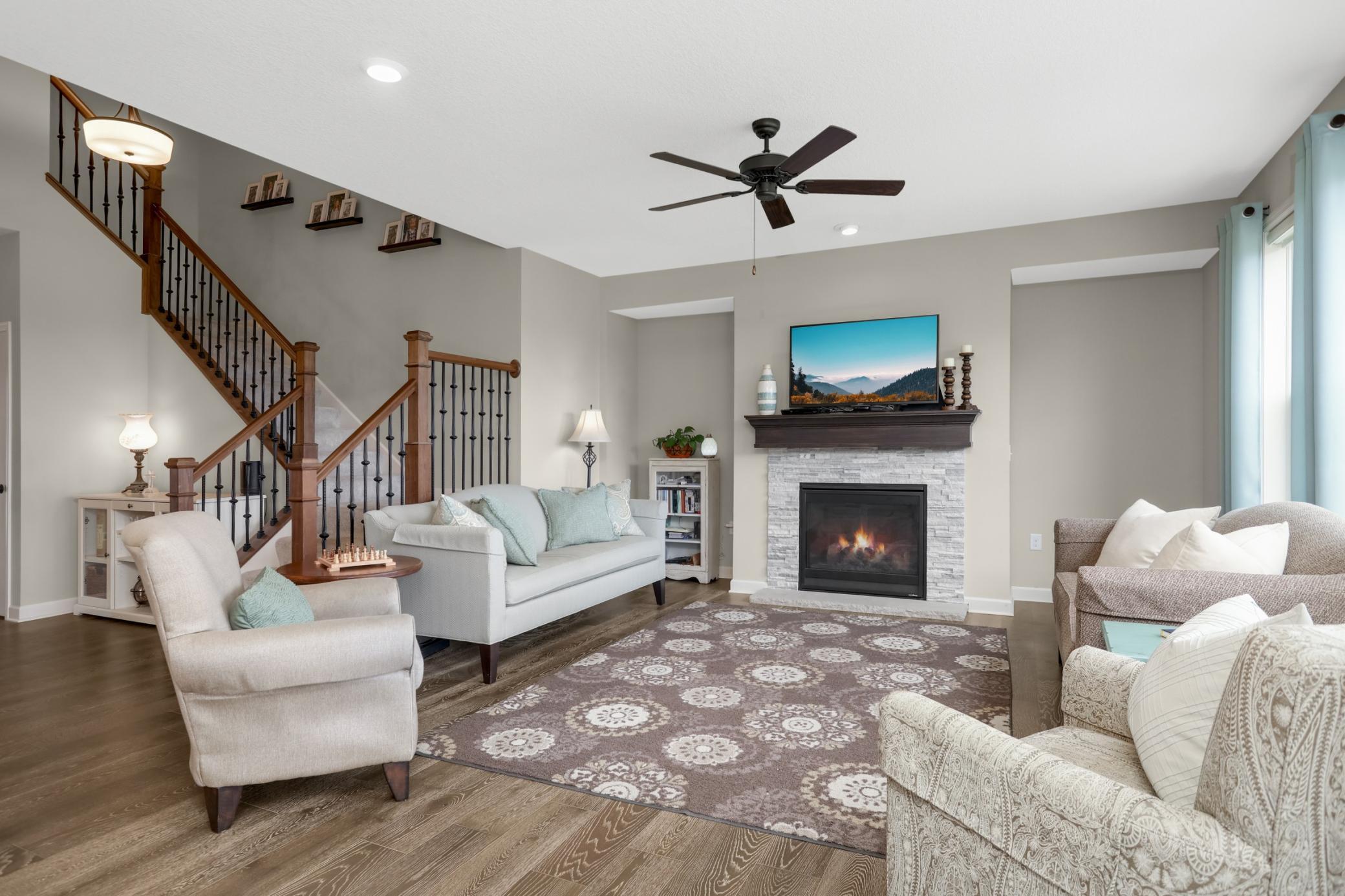 Note the gas fireplace with stone surround and wood mantle.