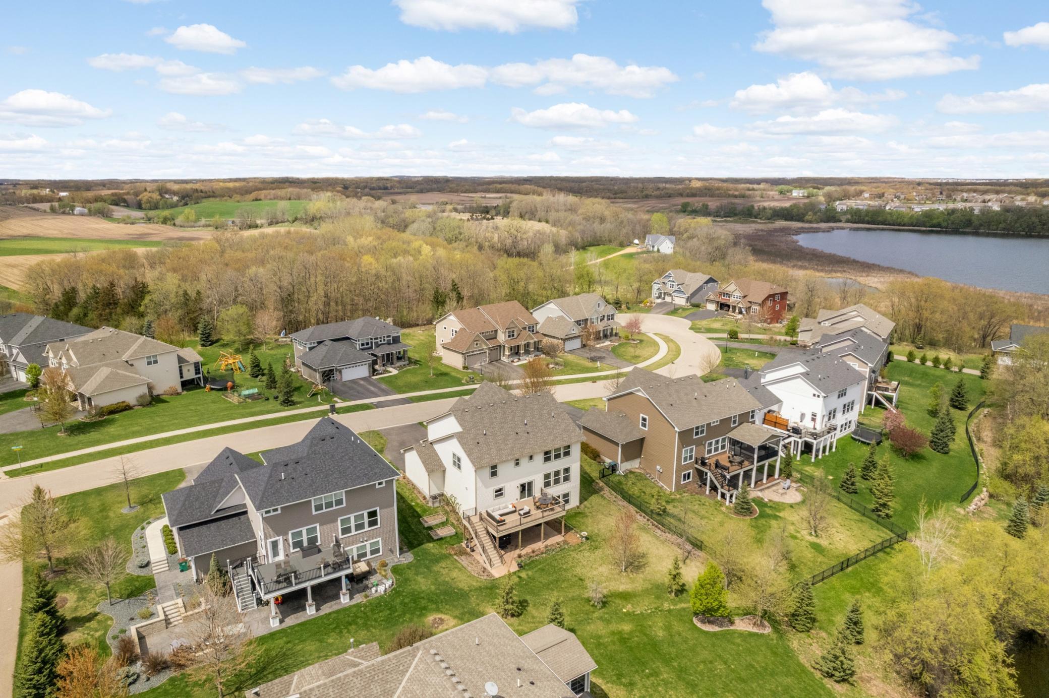 Aerial showing the rear of the home and the cul-de-sac street.