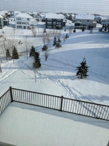 View of deck and pond in the winter.. The pond adds a lot of privacy to the yard.