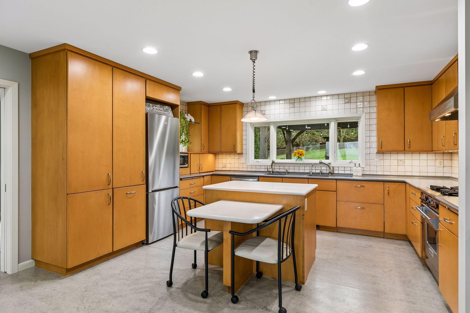 Ample storage space and room for quick meals on the convenient island!