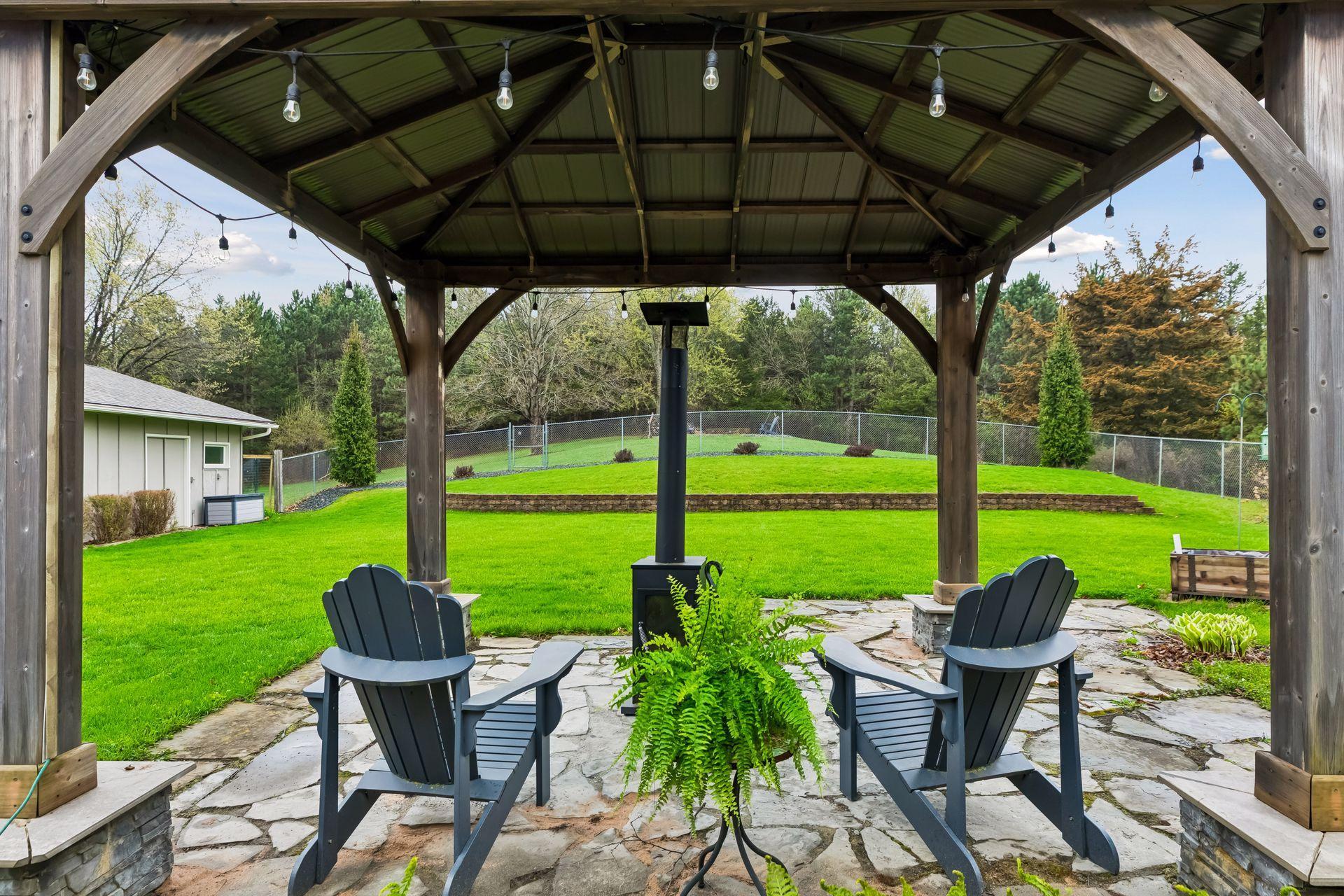 Backyard oasis providing a private setting with room for grilling, outdoor dining, and enjoying time outside comfortably.