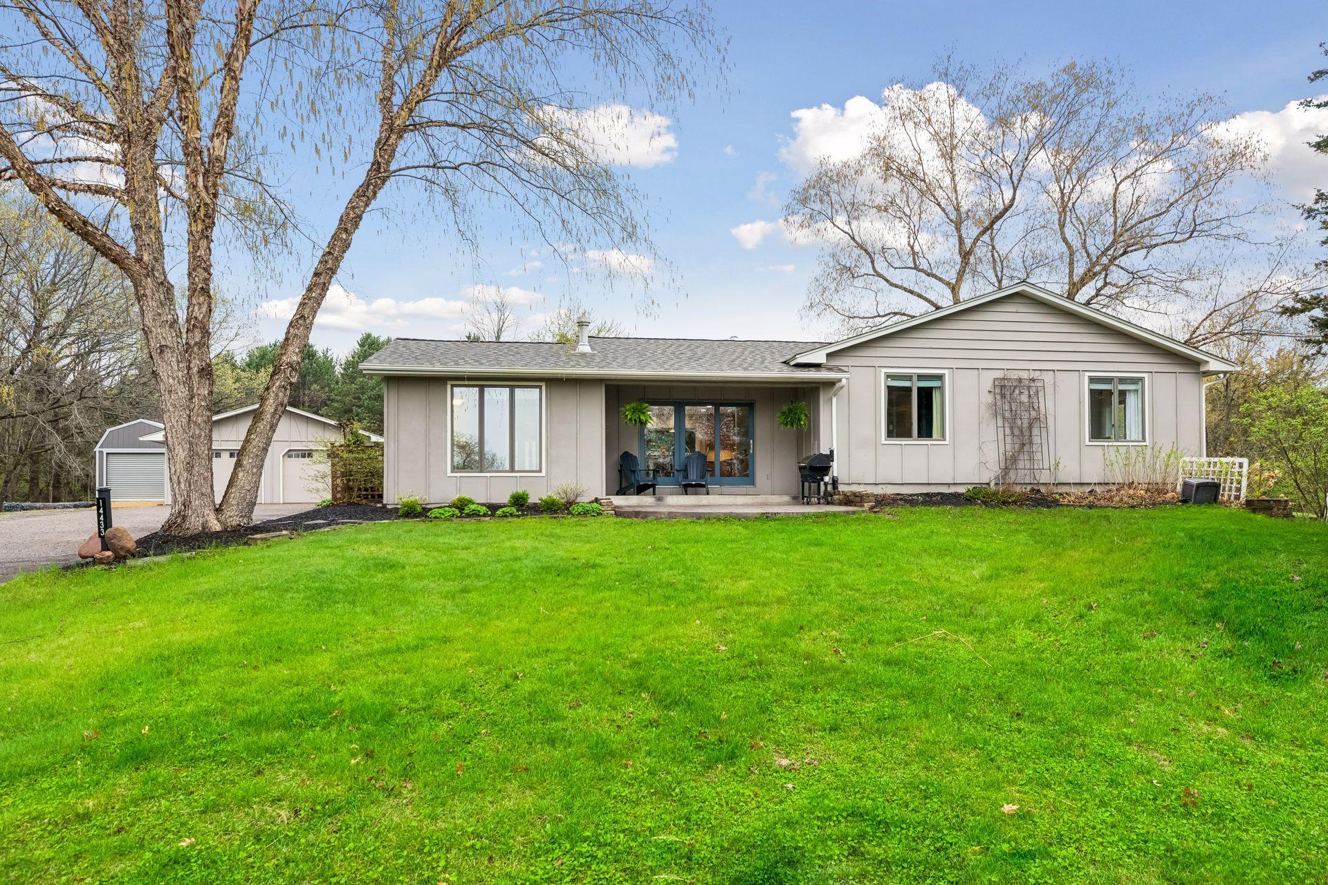 A welcoming front view of the home, set on a generous lawn offering plenty of space for outdoor entertaining and activities.