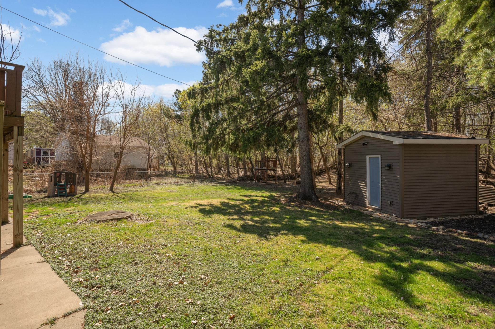 Shed in backyard is great for extra storage.