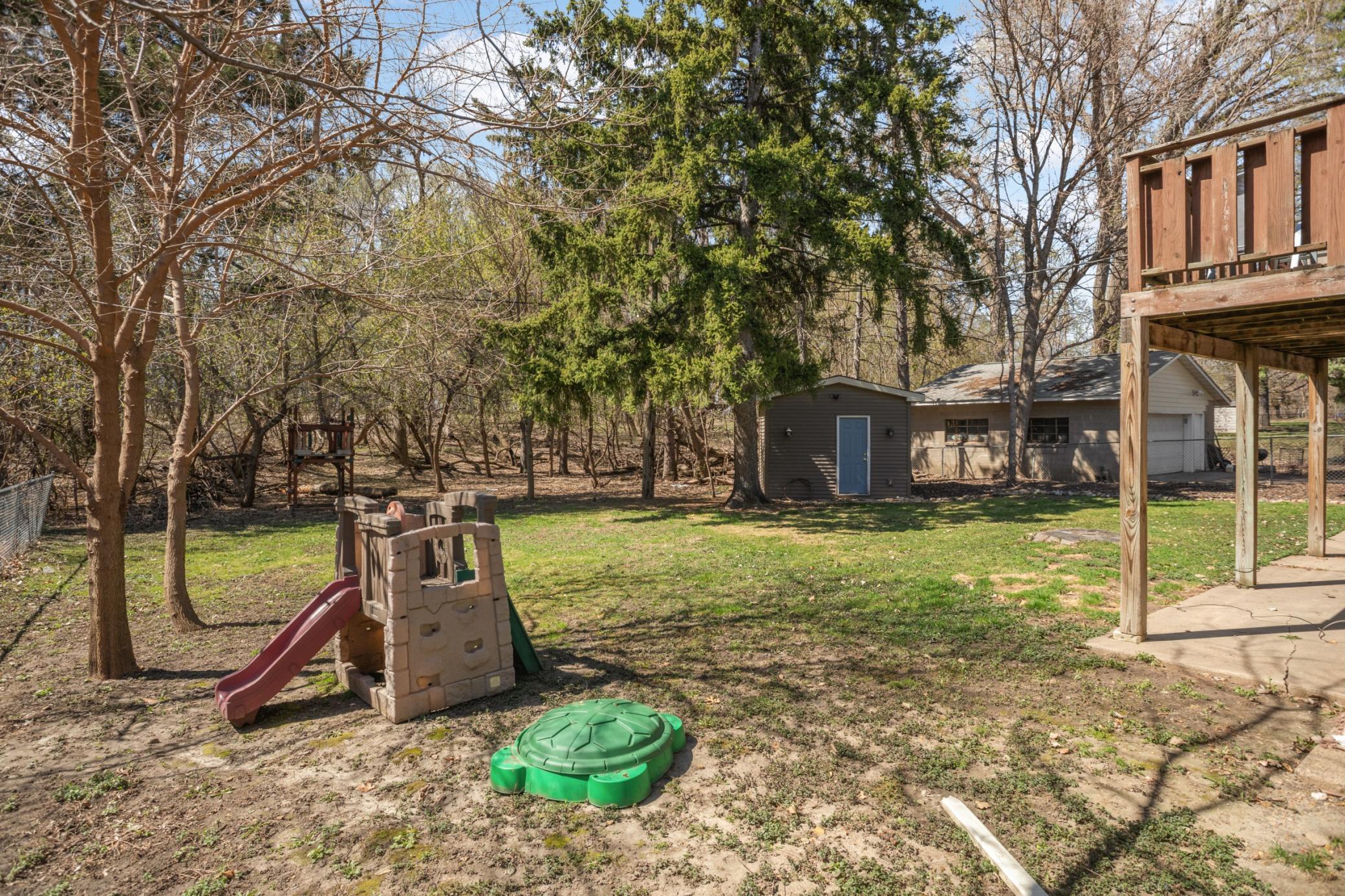 Back yard with mature trees.