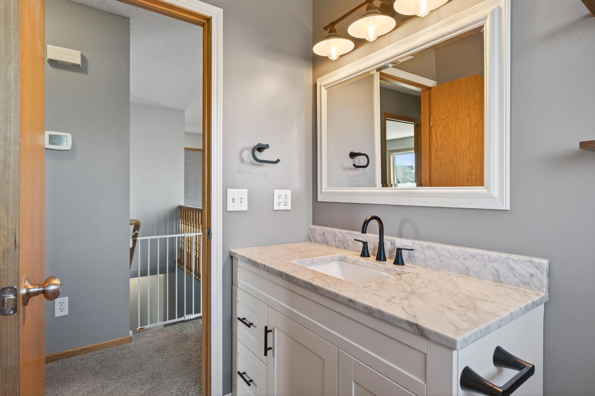 Upper-level bath, new vanity, mirror and lighting