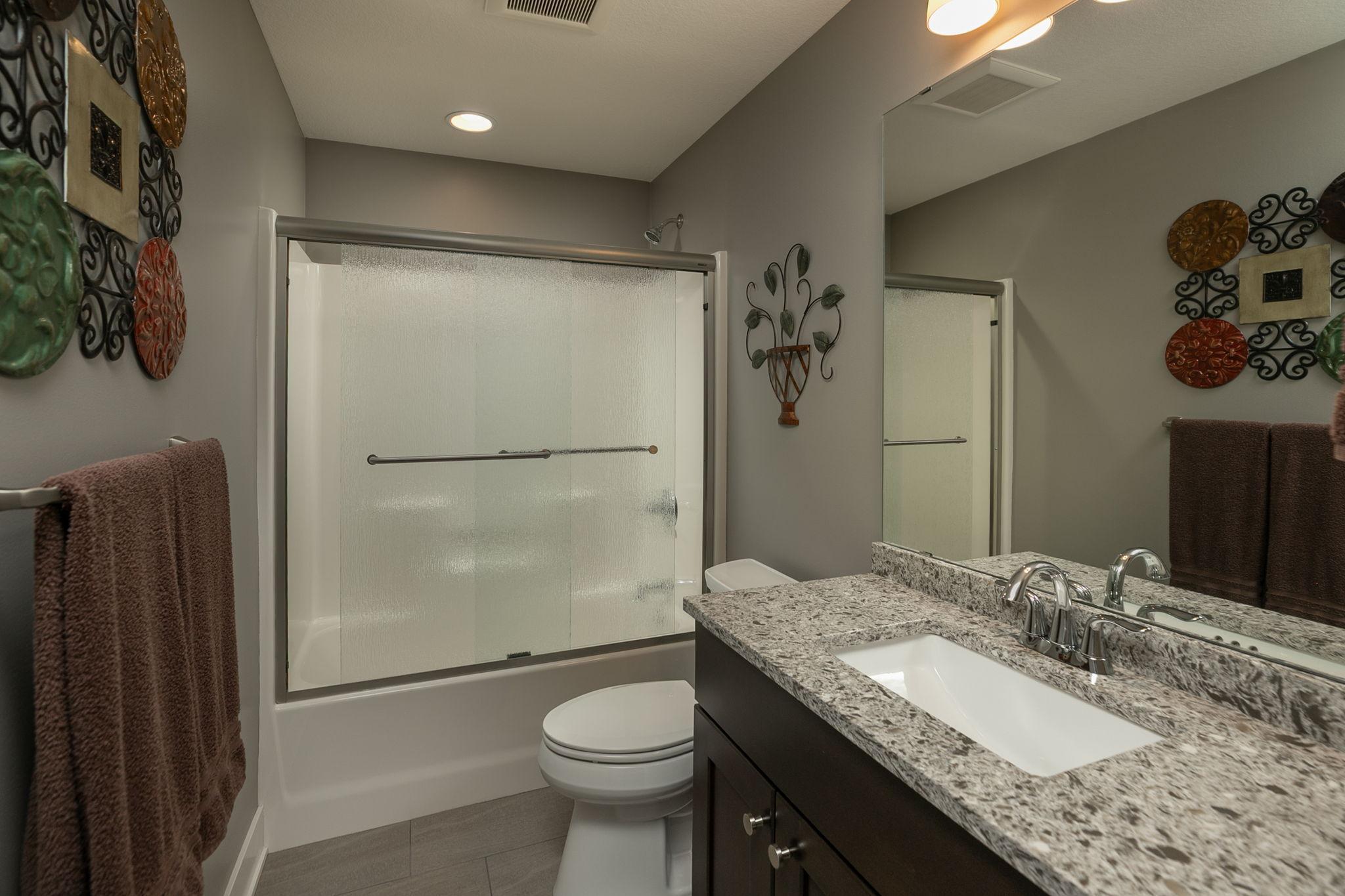 Third full bath in the home also with a glass door