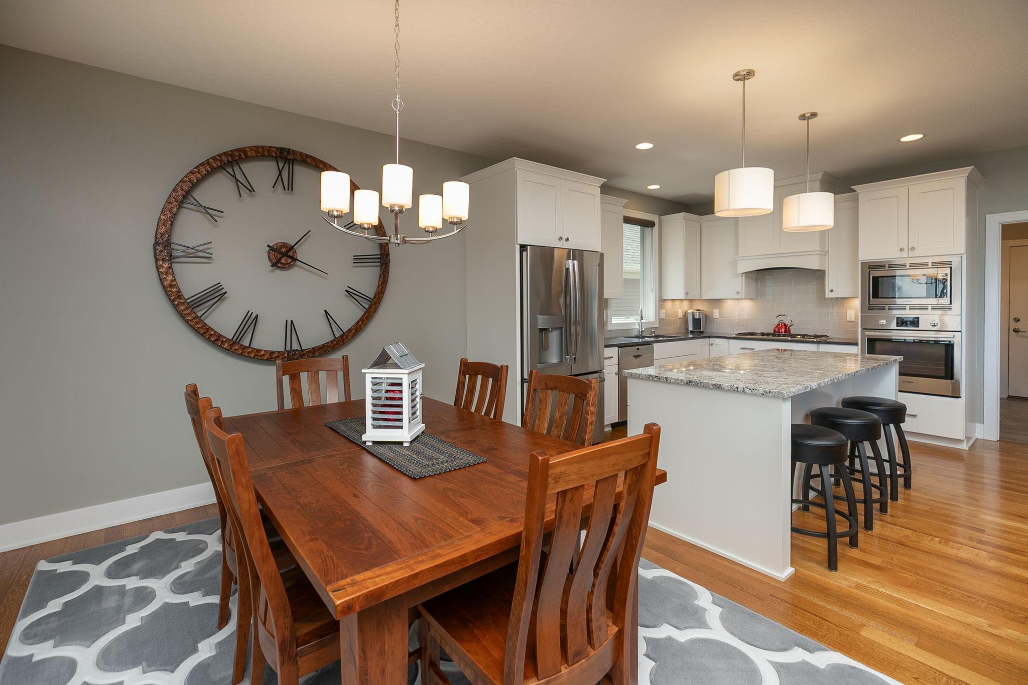 Beautiful white kitchen with additional seating at the island bar