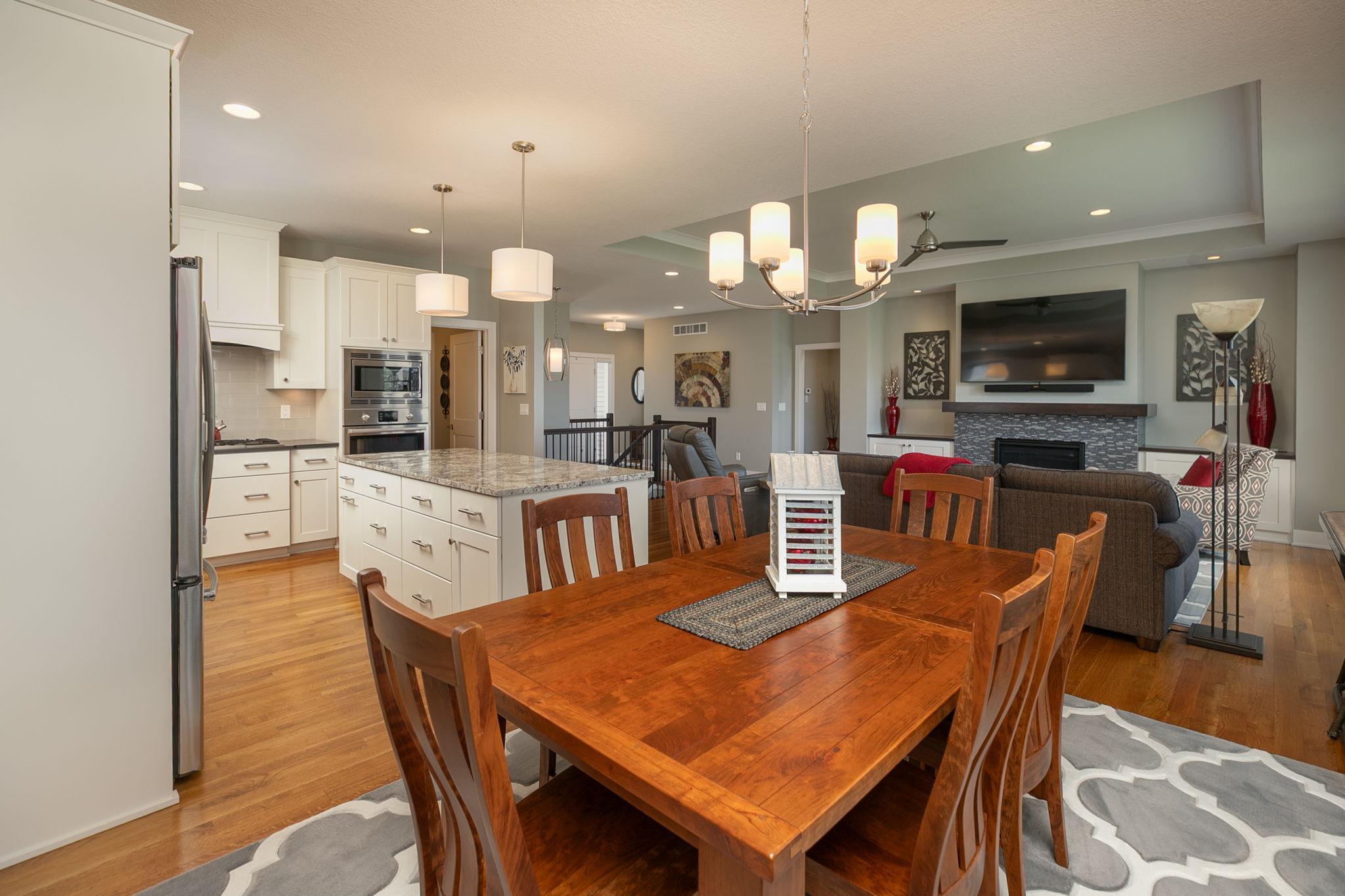 Stainless appliances, tiled backsplash and granite tops