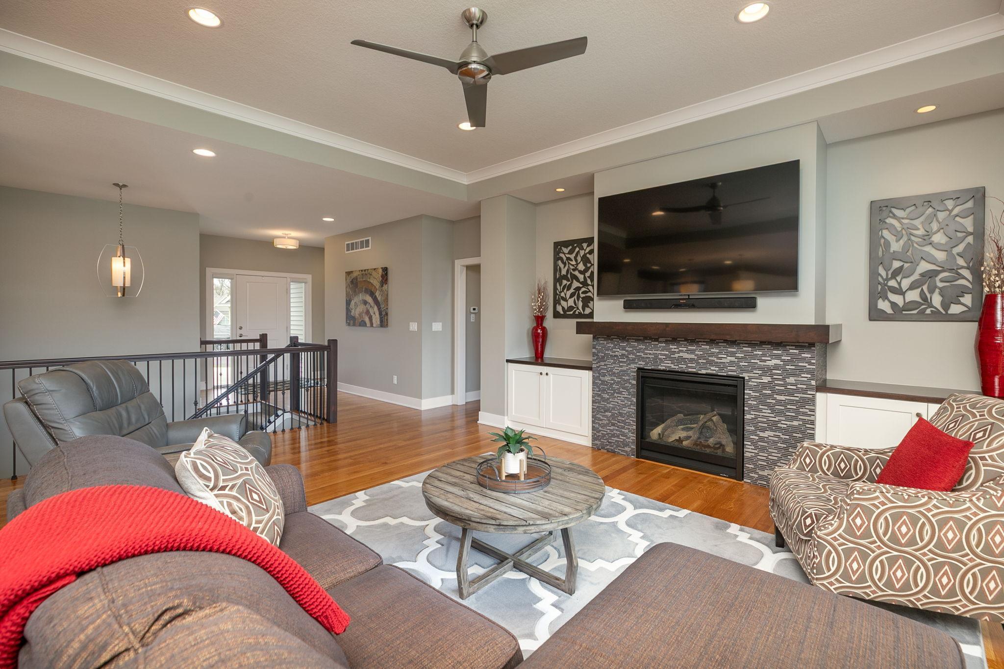 Fireplace is flanked by two built-ins and adequate space for a large TV above it