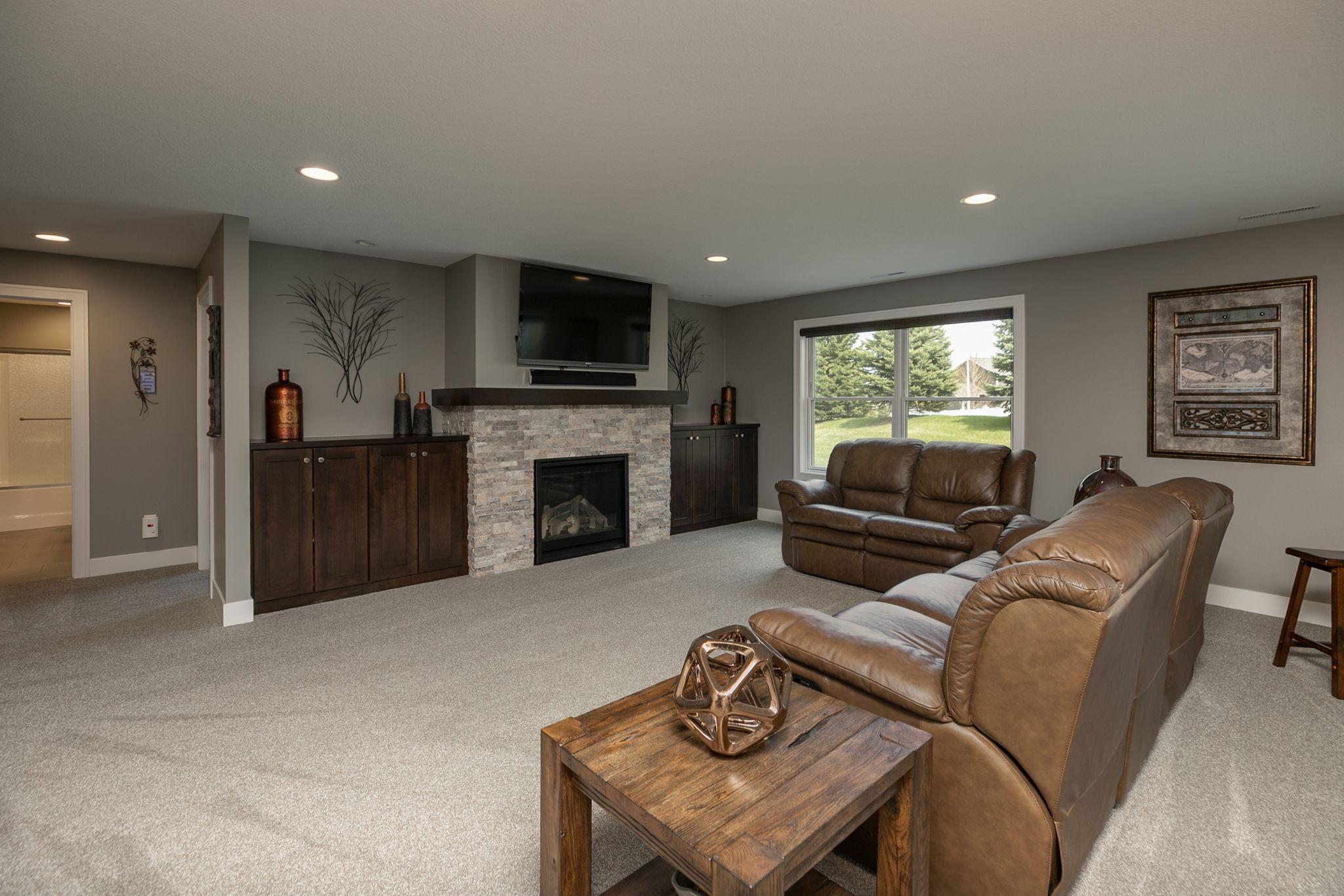 Walkout lower level with second fireplace and built-in cabinetry