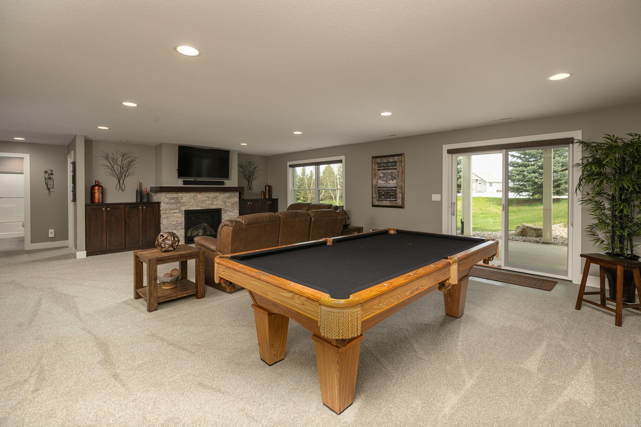 Plush carpeting and very well lit with an abundance of recessed lights