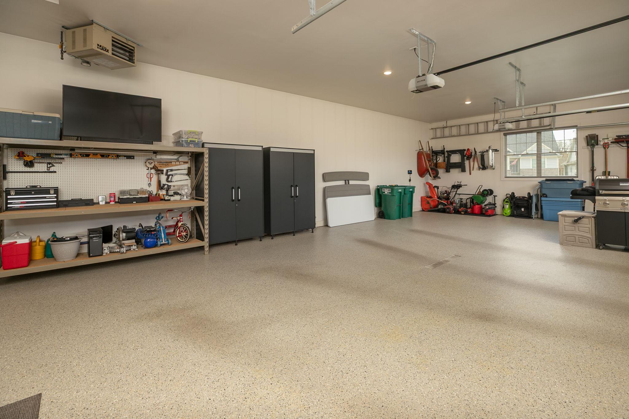 Oversized heated 3 car garage with epoxy flooring