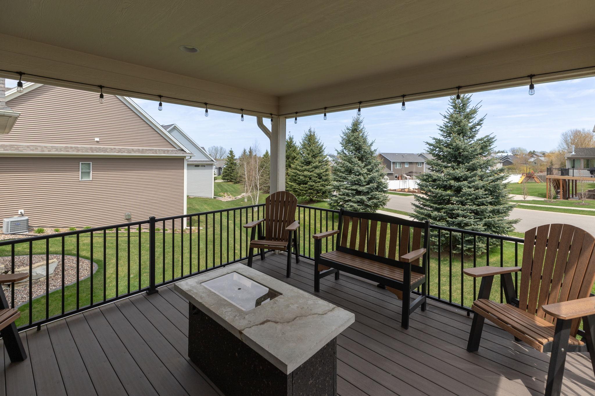 Covered composite deck with large pines for privacy