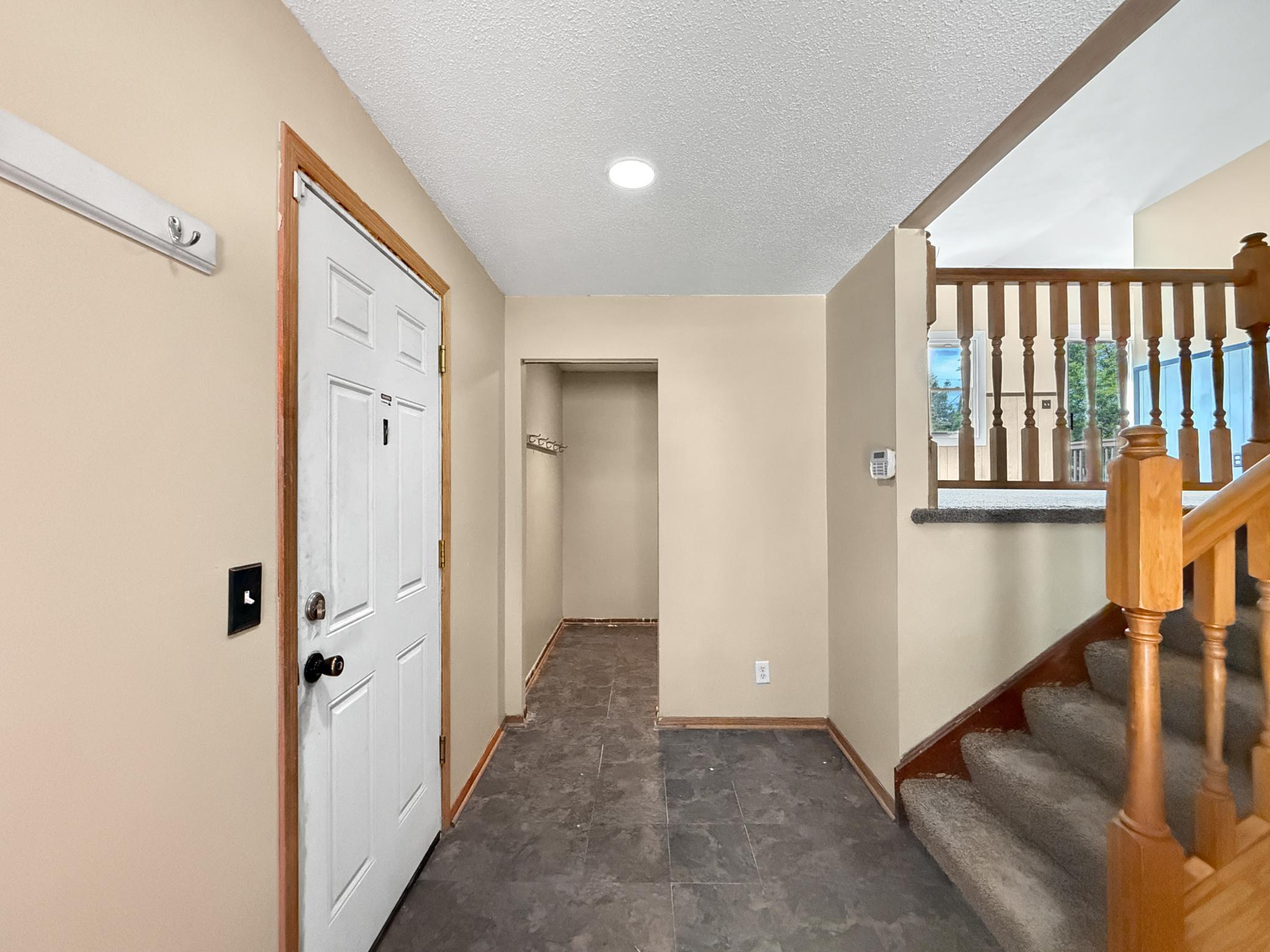 Step into the foyer with a large storage closet